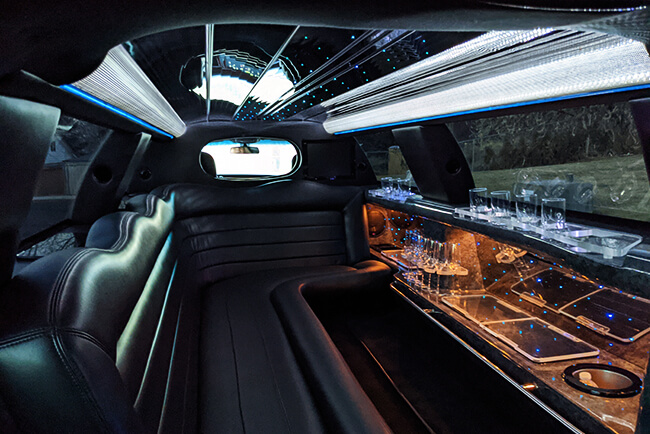 black leather seating and wide windows in our limos