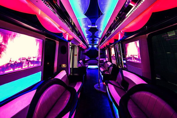 Hot pink bright neon lights inside a Limo Bus New York a party bus.